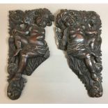 A pair of 17th/18thcentury Continental carved putto reliefs Each scantily clad winged figure before