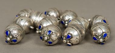 Twelve 19th century unmarked white metal beads Each set with lapis lazuli and opposing suspension