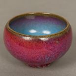 A Chinese Jun ware bowl With mottled red blue glaze. 5 cm high.