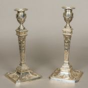 A pair of large silver candlesticks, hallmarked Sheffield 1952,