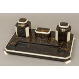 An Art Deco ivory and silver mounted coromandel desk stand Mounted with two inkwells centred with a
