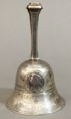 A George V silver presentation table bell, hallmarked London 1910, maker's mark of Carrington & Co.
