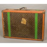A vintage Louis Vuitton travelling case Typically decorated in the LV livery with brass fittings,