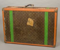 A vintage Louis Vuitton travelling case Typically decorated in the LV livery with brass fittings,