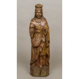 A Medieval style carving of a saint Modelled wearing a crown and in typical dress. 62 cm high.