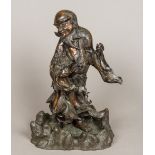 A 19th century Japanese bronze figure of an immortal Modelled in flowing robes embracing a mythical