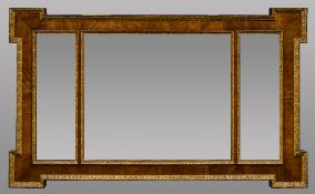 A walnut framed over mantel mirror With triptych plate. 113 cm wide.