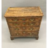 An early 18th century walnut chest of drawers With a brushing slide,