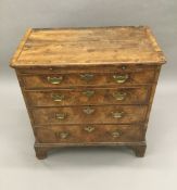 An early 18th century walnut chest of drawers With a brushing slide,