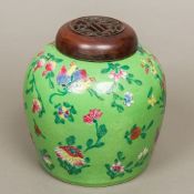An 18th/19th century Chinese porcelain ginger jar and cover Brightly decorated with floral sprays