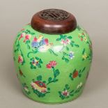 An 18th/19th century Chinese porcelain ginger jar and cover Brightly decorated with floral sprays