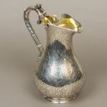 A Victorian silver jug, hallmarked London 1856,