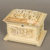 A 19th century Canton carved ivory casket The hinged domed lid inset with a deeply carved panel