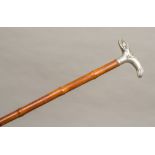 A Victorian silver handled walking stick, hallmarked London 1895,