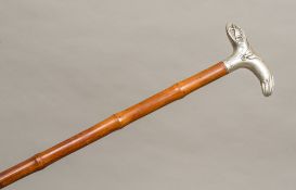 A Victorian silver handled walking stick, hallmarked London 1895,