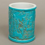 A Chinese blue glazed porcelain brush pot Of cylindrical form,