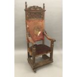 A 19th century Continental carved walnut open armchair The high back carved with twin shield