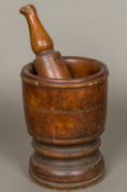 A 17th/18th century large turned wood pestle and mortar With turned decoration. 24 cm high.