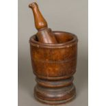 A 17th/18th century large turned wood pestle and mortar With turned decoration. 24 cm high.