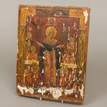 A Russian icon Painted with various saintly figures on wooden board,