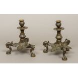 A pair of French Napoleon III bronze candle stands The urn shaped socles supported on an anthemion
