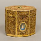 An early 19th century rolled paper tea caddy Of octagonal hinged form,