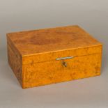 A good quality burrwood veneered Dunhill humidor Of hinged rectangular form,