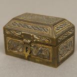 A 19th century Islamic Cairo ware mixed metal inlaid brass casket Of hinged domed rectangular form.
