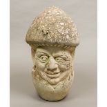 A 20th century limestone carving Formed as a male bust hatching from an egg,