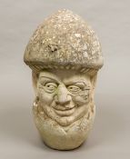 A 20th century limestone carving Formed as a male bust hatching from an egg,