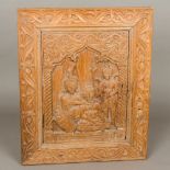 A 19th century Tibetan carved wooden panel Depicting Buddhist figures. 43.5 cm wide.