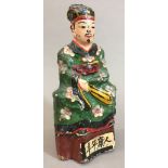 A 19th century Chinese carved wood and polychrome decorated tomb type figure Modelled seated in