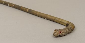 A late 19th century Chinese horn and ivory segmental walking stick The handle carved as a dragon