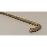 A late 19th century Chinese horn and ivory segmental walking stick The handle carved as a dragon