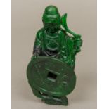 A Chinese carved green hardstone model of Buddha Formed holding a branch and a coin. 13 cm high.