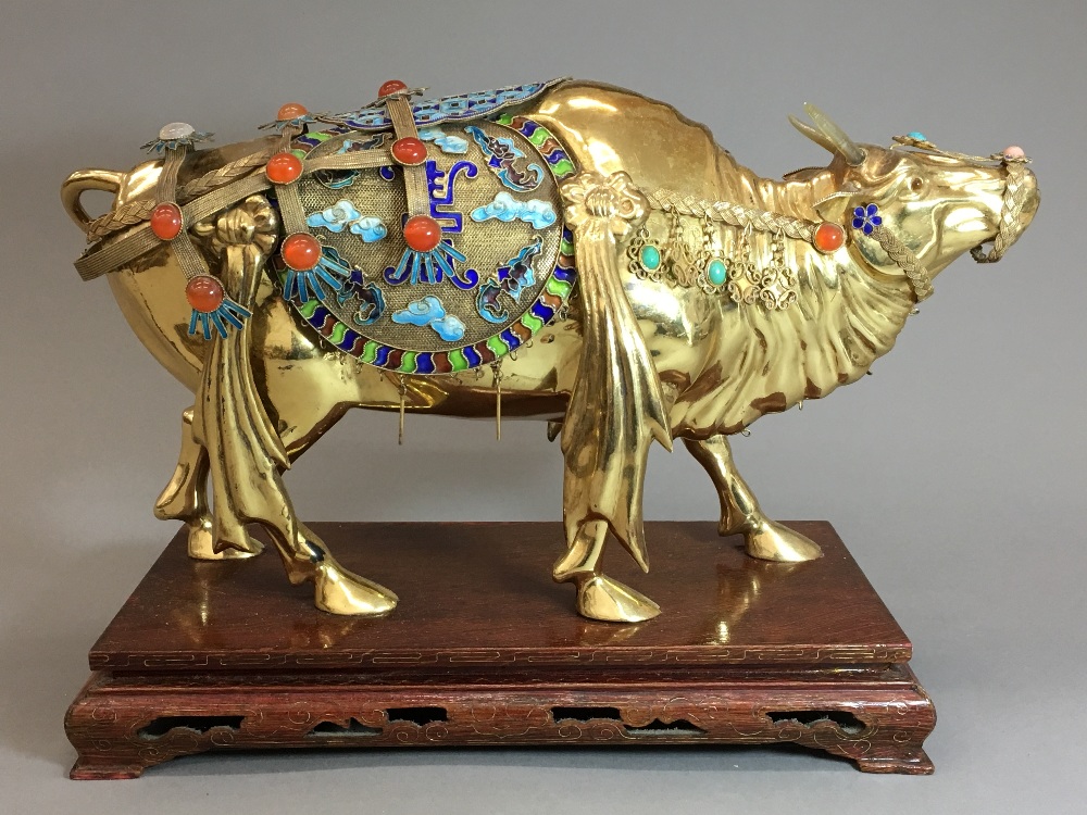 A Chinese Republic period 925 silver and gold washed figure of an ox Finely adorned with coloured