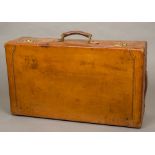 A good quality early 20th century leather covered suitcase Of typical rectangular form with brass