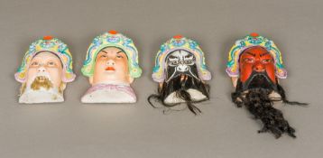 A set of four late 19th century Japanese masks of Noh Each set with a headdress,