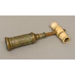 A 19th century Thomason brass corkscrew The turned ivory handle above the cast Gothic barrel,