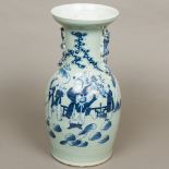 A 19th century Chinese blue and white vase Of flared baluster form with dog-of-fo handles,