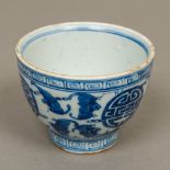 A Chinese blue and white porcelain tea bowl Decorated in the round with bats and geometric roundels,