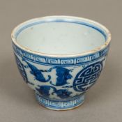 A Chinese blue and white porcelain tea bowl Decorated in the round with bats and geometric roundels,