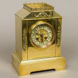 A 19th century French brass cased mantle clock by A D Mougin The ivory coloured sectional dial with