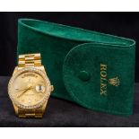 An 18K gold gentleman's Rolex Day-Date oyster perpetual wristwatch The diamond set bezel enclosing