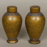 A pair of 19th century Persian papier mache lidded vases,