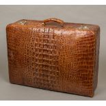A vintage crocodile skin suitcase 60 cm wide.