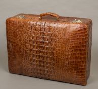 A vintage crocodile skin suitcase 60 cm wide.