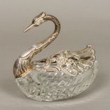 A silver mounted cut glass dish, marked 925 Formed as a swan with pierced hinged wings. 13 cm long.