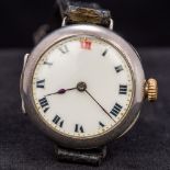 An early 20th century gentleman's silver cased Rolex trench watch The white enamelled dial with