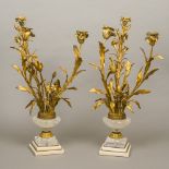 A pair of gilt bronze and rock crystal candelabra Of floral urn form,